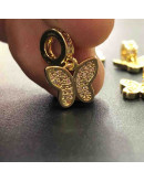 Mariposa. Aleación+Zirconia. Baño 18k gold. 20 milímetros. 2,5 mm perforación. 1 unidad.