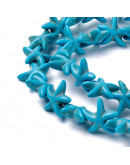 Turquesa sintética. Estrellas de mar. Color azul. 14x14 mm. 1 mm perforación. 35 uds hilo aprox.