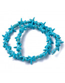 Turquesa sintética. Estrellas de mar. Color azul. 14x14 mm. 1 mm perforación. 35 uds hilo aprox.