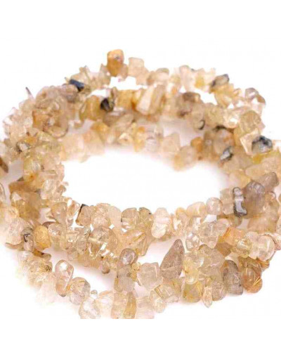 Chips 5-8 milímetros. Cuarzo Rutilado. 0,8 mm perforación. 250 unidades hilo aproximado. 1 hilo.