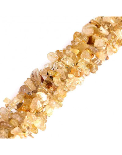 Chips 5-8 milímetros. Cuarzo Rutilado. 0,8 mm perforación. 250 unidades hilo aproximado. 1 hilo.