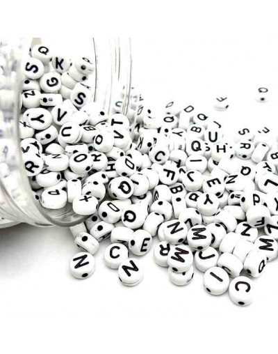 Letra negra. Moneda blanca. 7 milímetros diámetro. 1,5 mm perforación.3900 uds aprox. 500 gramos.