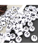 Letra negra. Moneda blanca. Letra "N". 7 mm diámetro. 1,5 mm perforación. 100 uds. aproximado. Letra negra. Moneda blanca. Letra "N". 7 mm diámetro. 1,5 mm perforación. 100 uds. aproximado.