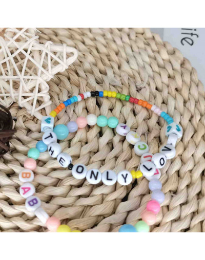 Letra negra. Moneda blanca. Letra "N". 7 mm diámetro. 1,5 mm perforación. 100 uds. aproximado.