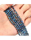 Barril faceteado. Blue Full Rainbow Plated. 6x4 mm. 1 mm perforación. 65 uds hilo aprox. 1 hilo