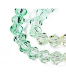 Bi-cono. Color degradado: verde a naranja. 4.5x4 mm. 0.8 mm perforación. 80 uds hilo aprox.