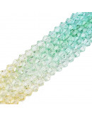 Bi-cono. Color degradado: verde a naranja. 4.5x4 mm. 0.8 mm perforación. 80 uds hilo aprox.