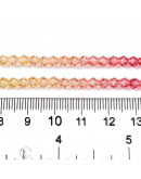 Bi-cono. Color degradado: naranja a rojo. 4.5x4 mm. 0.8 mm perforación. 80 uds hilo aprox.