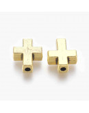 Cruz (1). Aleación de cobre. Color oro antiguo. 15x12x5 mm. 2 mm perforación. 10 unidades