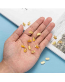 Terminales. Aleación de cobre. Color dorado. 10x7 milímetros. 2 mm perforación. 40 uds aprox.