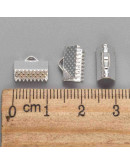 Terminales. Aleación de cobre. Color plateado. 10x7 milímetros. 2 mm perforación. 40 uds aprox.