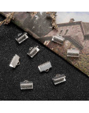 Terminales. Aleación de cobre. Color plateado. 10x7 milímetros. 2 mm perforación. 40 uds aprox.