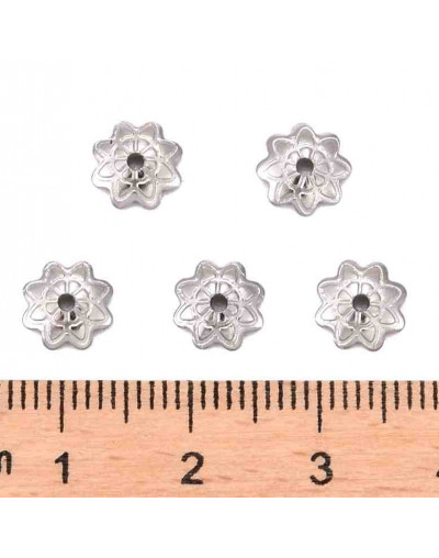 Acero inoxidable. Color plateado. Flor 8 pétalos. 7 mm diámetro. 1 mm perforación. 20 uds aprox.