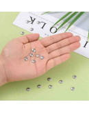 Acero inoxidable. Color plateado. Flor 8 pétalos. 7 mm diámetro. 1 mm perforación. 20 uds aprox.