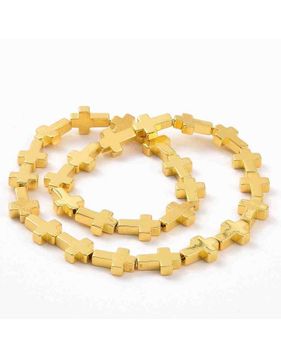 Hematite sintético. Cruz. Color dorado. 14x10x4 mm. 1 mm perforación. 1 ud.