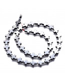 Hematite sintético. Cruz. Color Gunmetal. 10x8x3 mm. 1 mm perforación. 1 ud.