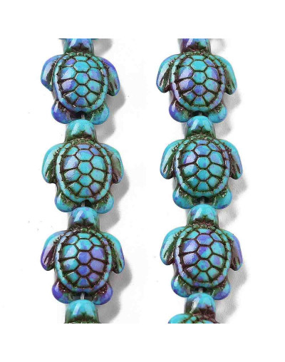 Howlite sintético. Tortugas. Color mauve. 17x14x7.5 mm. 1,6 mm perforación. 22 uds hilo aprox.