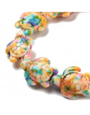 Howlite sintético. Tortugas. Colorful. 17x14x7.5 mm. 1,6 mm perforación. 22 uds hilo aprox.