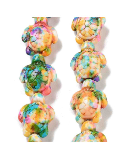 Howlite sintético. Tortugas. Colorful. 17x14x7.5 mm. 1,6 mm perforación. 22 uds hilo aprox.
