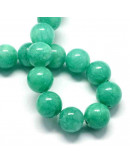 Jade. Aquamarine Teñido. 06 mm diámetro. 1 mm perforación. 60 uds hilo aprox. 1 hilo.