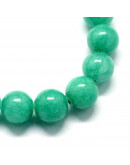 Jade. Aquamarine Teñido. 06 mm diámetro. 1 mm perforación. 60 uds hilo aprox. 1 hilo.