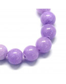 Jade. Medium Purple Teñido. 06 mm diámetro. 1 mm perforación. 60 uds hilo aprox. 1 hilo.