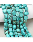 Howlite. Nuggets Tumbled. Teñido Turquesa. 8~11x6~10x5~8 mm. 1 mm perforación. 20 uds aprox. 1 hilo.