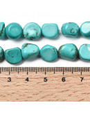 Howlite. Nuggets Tumbled. Teñido Turquesa. 8~11x6~10x5~8 mm. 1 mm perforación. 20 uds aprox. 1 hilo.