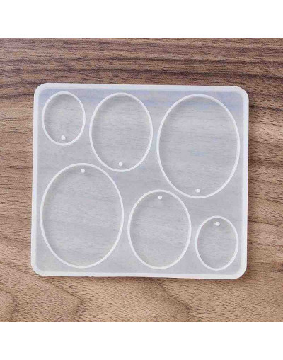 Molde para resina. Dijes y aretes. Ovalos. 109x98x5.5 mm. 2 mm perforación. 1 ud.