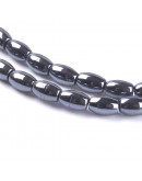 Hematite sintético. Gun Metal. Ovalado. 5x3 mm. 0.8 mm perforación. 70 uds aprox. 1 hilo.